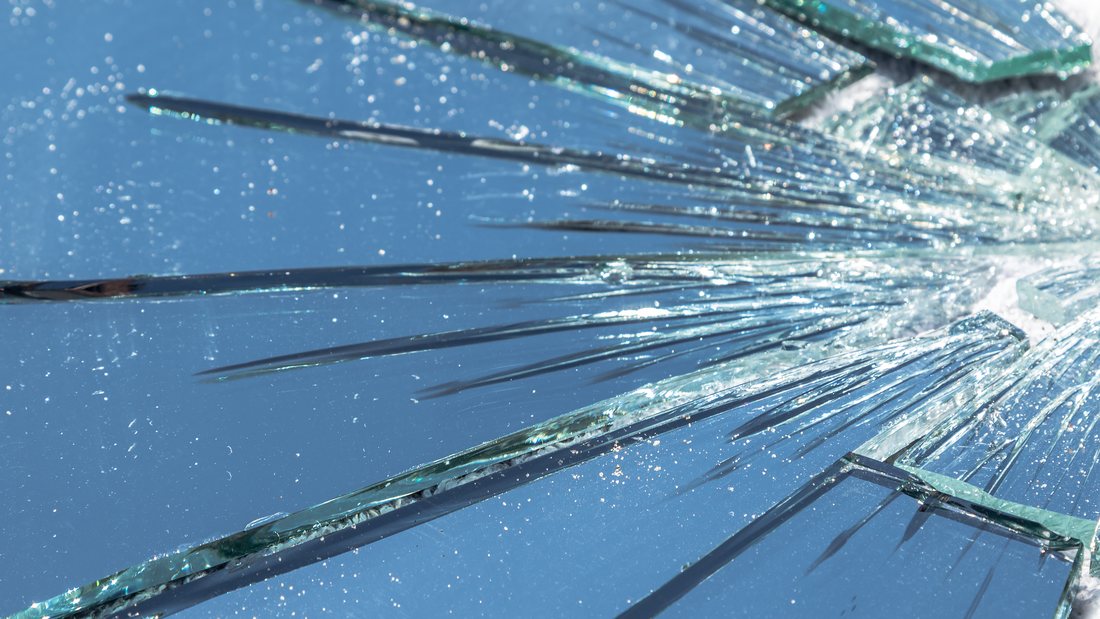 Cracked glass held together by security film