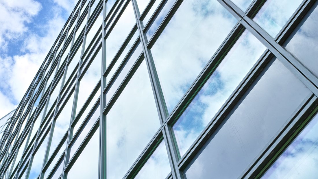 Sunlight on a glass facade with solar control film