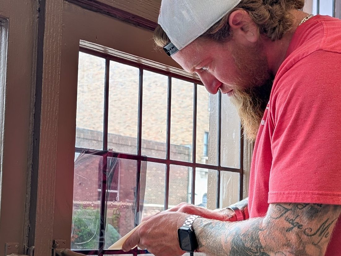 Hand-fitting film to leaded glass on a commercial job
